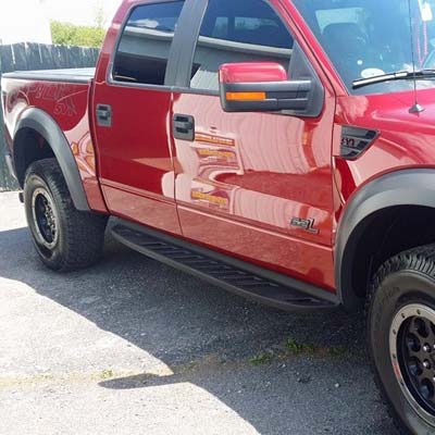 red crew cab truck after wash