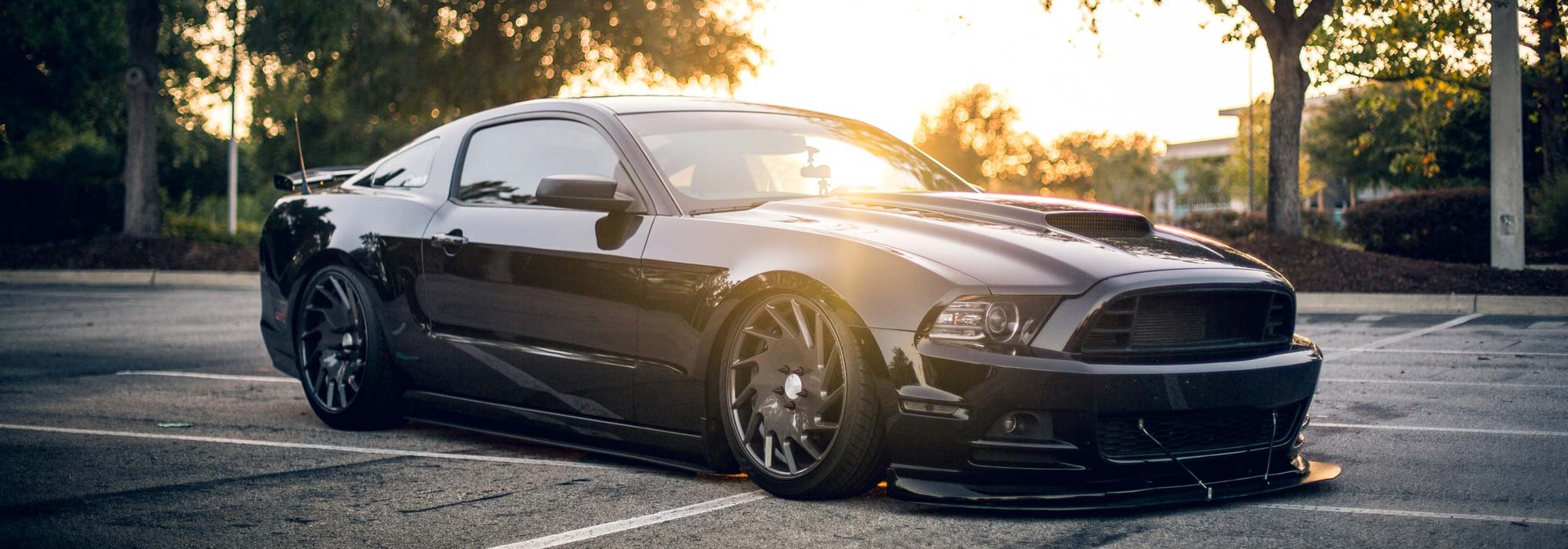 Grey Mustang in parking lot